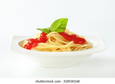 Side View Of Bowl With Fresh Pasta And Simple Tomato Sauce With Fresh Basil Leaves