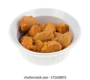 A Side View Of A Bowl Of Naturally Moist And Tasty Canned  Yams On A White Background.