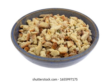 Side View Of A Bowl Of Uncooked Stovetop Stuffing Ingredients Isolated On A White Background.