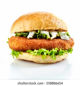 Side View Of Breaded Chicken Burger With Fresh Salad On White Background