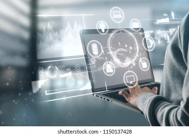Side view of businessman hands using laptop with business interface. Future and finance concept. Double exposure  - Shutterstock ID 1150137428