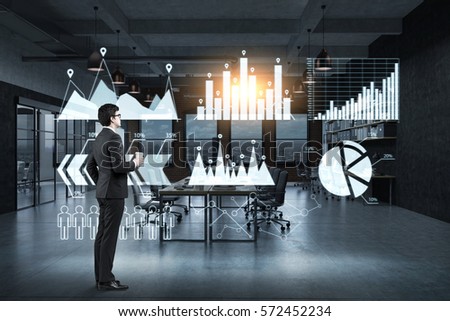 Side view of a businessman with a paper cup of coffee standing near a glassboard with six graphs drawn on it. Toned image