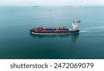 side view Cargo Container Ship with contrail in the ocean ship carrying container and running for export concept technology freight shipping by ship 