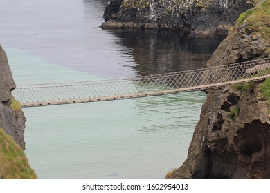 Side View Of The Carrick-a-Rede Rope Bridge, County Antrim, Northern Ireland.