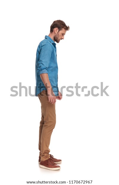 side view casual man looking down stock photo edit now 1170672967 https www shutterstock com image photo side view casual man looking down 1170672967