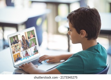 Side View Of Caucasian Boy Learning From Woman Teaching Online Over Video Call On Laptop At Home. Screen, Internet, Unaltered, Childhood, Wireless Technology, Education, Student And E-learning.