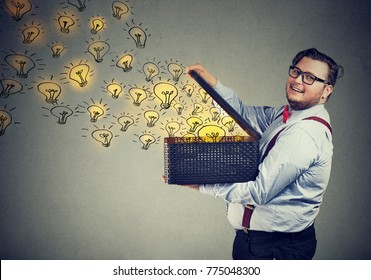 Side view of chunky man holding box with brilliant ideas bein creative and smiling at camera.  - Shutterstock ID 775048300
