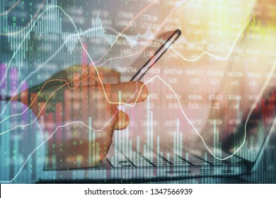 Side view and close up of hands using laptop and smartphone with forex chart. Analytics and finance concept. Double exposure 
