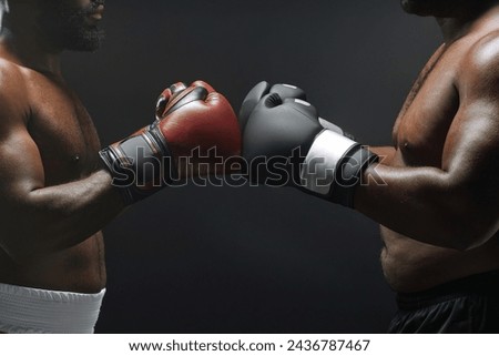 Side view close up of two fighters bumping boxing gloves before fight in ring, copy space