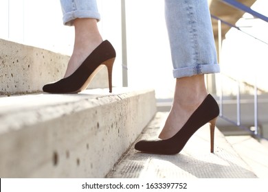 Side View Close Up Of A Woman Legs Wearing High Heels Walking Up Stairs