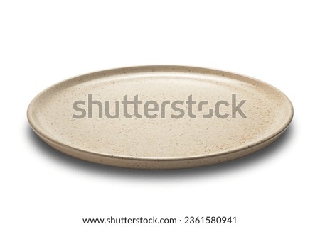 Side view closeup of brown ceramic plate isolated on white background with clipping path.
