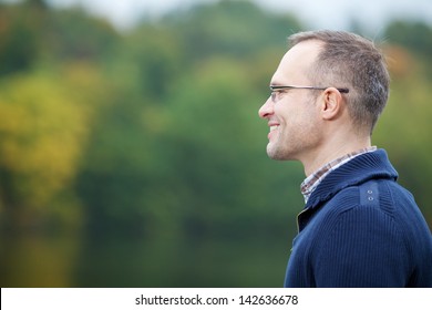 Side View Of Confident Mature Man Smiling