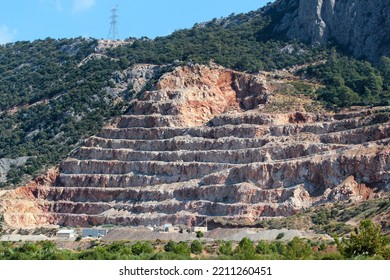 Side View Of Construction Aggregate Quarry, Stepped Slope Of A Mountain