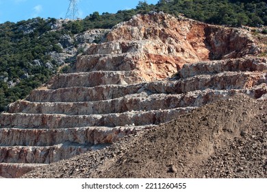 Side View Of Construction Aggregate Quarry, Stepped Slope Of A Mountain