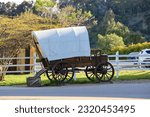 Side view of the covered wagon on display at Old Town San Diego State Historic Park.