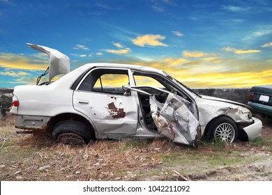 Side View Of Crash Car With Blue Sky