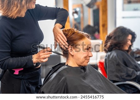 Similar – Image, Stock Photo Cropped unrecognizable female hairstylist using electric trimmer on male client’s hair at salon