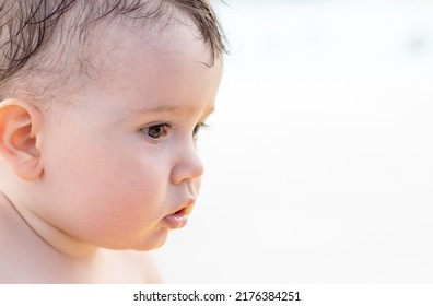 Side View Of Cute Baby Little Toddler Boy,face Profile On Blurry Pool Background.wet Hair,naked Baby.vacation With Kids Concept,tourism,travel,pool Day