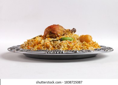 Side View Of Delicious Spicy Chicken Biryani In White Plate On White Background, Indian Or Pakistani Food Specially For Christmas And Eid.