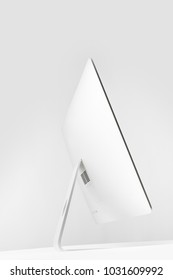 side view of desktop computer display on white 
