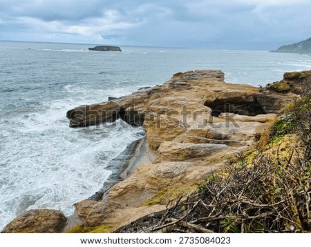 Side View Of The Devils Punchbowl Sitting Off The Pacific Ocean In Otter Rock, Oregon