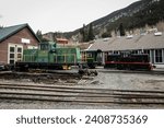 Side view of diesel locomotive shunters of Georgetown loop railroad in Colorado, USA. Engines are parked in a depot, looking from the low profile.