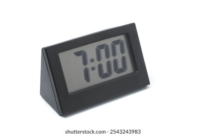 Side view of digital clock displaying "7:00" on white background.