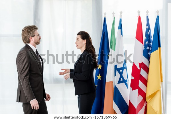 Side View Diplomats Talking Near Flags Stock Photo 1571369965 ...