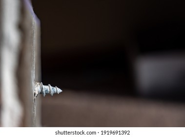 Side View Of A Drywall Mount Anchor And Screw For Hanging Objects On Walls