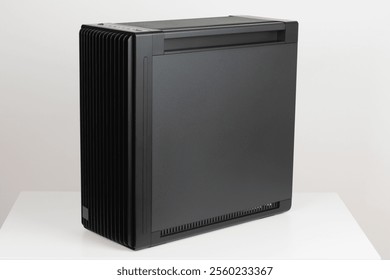 Side view of empty  big tower, PC case, chassis,  15.5 mm front panel grille with 45% porosity for maximum air intake.Studio shoot on white background. 