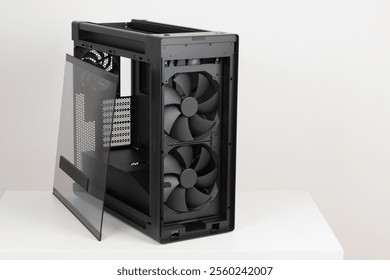 Side view of empty  big tower, PC case, chassis, removable tempered-glass left panel, two extra-thick 200 x 38 mm front fans for maximum air intake
