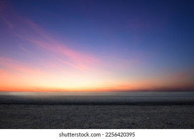 Side view of empty tarmac road with dawn sky background. - Shutterstock ID 2256420395