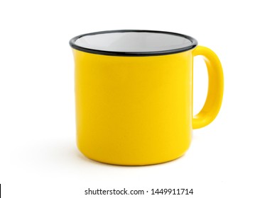 Side view of empty yellow enamel coffee mug isolated on white background