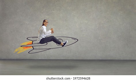 Side view of excited smiling laughing woman flying in air riding hand drawn cartoon doodle rocket with burning blast off flame. Using creative power, reaching success, achieving business goal concept