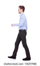 Side View Of A Fashion Man Walking Forward Over White