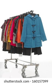 Side View Female Clothes With Coat Hanging On Clothes Rack On White