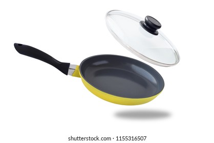 Side View Of Flying Or Falling Frying Pan With Glass Cover. Kitchen Cooking Utensil For Food Preparation Isolated On White Background