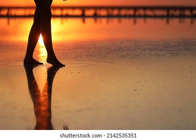 side view Footage of Beautiful Young Woman in the Swimsuit Walking on the Beach towards the Sea. Girl is Very Slim. - Shutterstock ID 2142535351