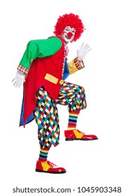 Side view full length picture of a clown imitating comic walk 