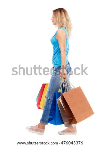 Similar – Image, Stock Photo Young woman walking past yellow building. Motion blur image. Person moving in the city.
