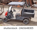 Side View of a Golf Cart with a Cargo Bed