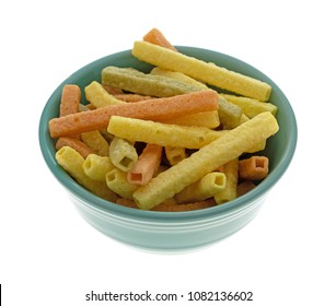 Side view of a green bowl filled veggie straws isolated on a white background.