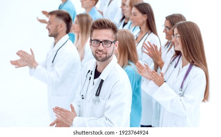 side view. a group of applauding doctors looking at the camera