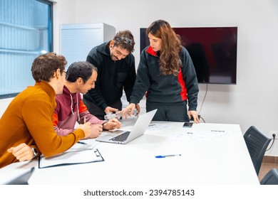 Side view of a group of logistics, ecommerce and business people working on laptop