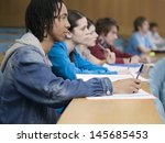 Side view of a group of multiethnic students in lecture room