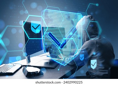 Side view of hacker at desktop using laptop with glowing hexagonal shield hologram with binary coding on blurry background. Safety, hacking, malware and internet concept. Double exposure