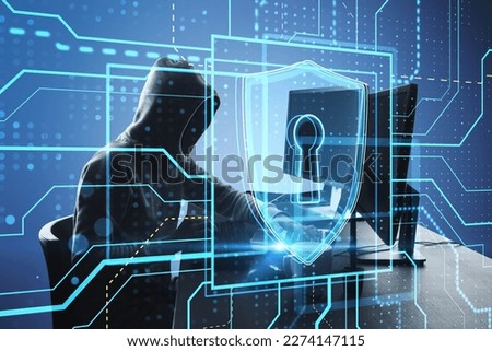 Side view of hacker using computers at desktop with glowing safety and security circuit padlock shield hologram on blurry background. Hacking and data theft concept. Double exposure