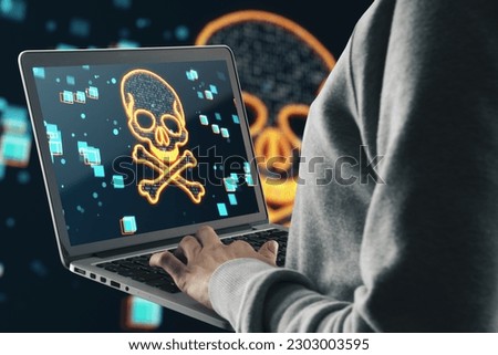Side view of hacker using laptop with glowing digital binary code skull on blurry dark background. Hacking, piracy, malware and data theft concept