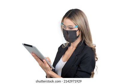 Side View And Half Shot Of Masked Business Woman And Face Shield Working On Electronic Tablet In Accordance With Social Distancing Policy On White Background.