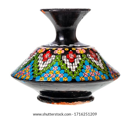 side view of handcrafted ceramic vase made in Atlas Mountain of Marocco in the middle of 20th century isolated on white background